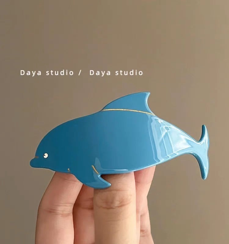 Dolphin hair clip.